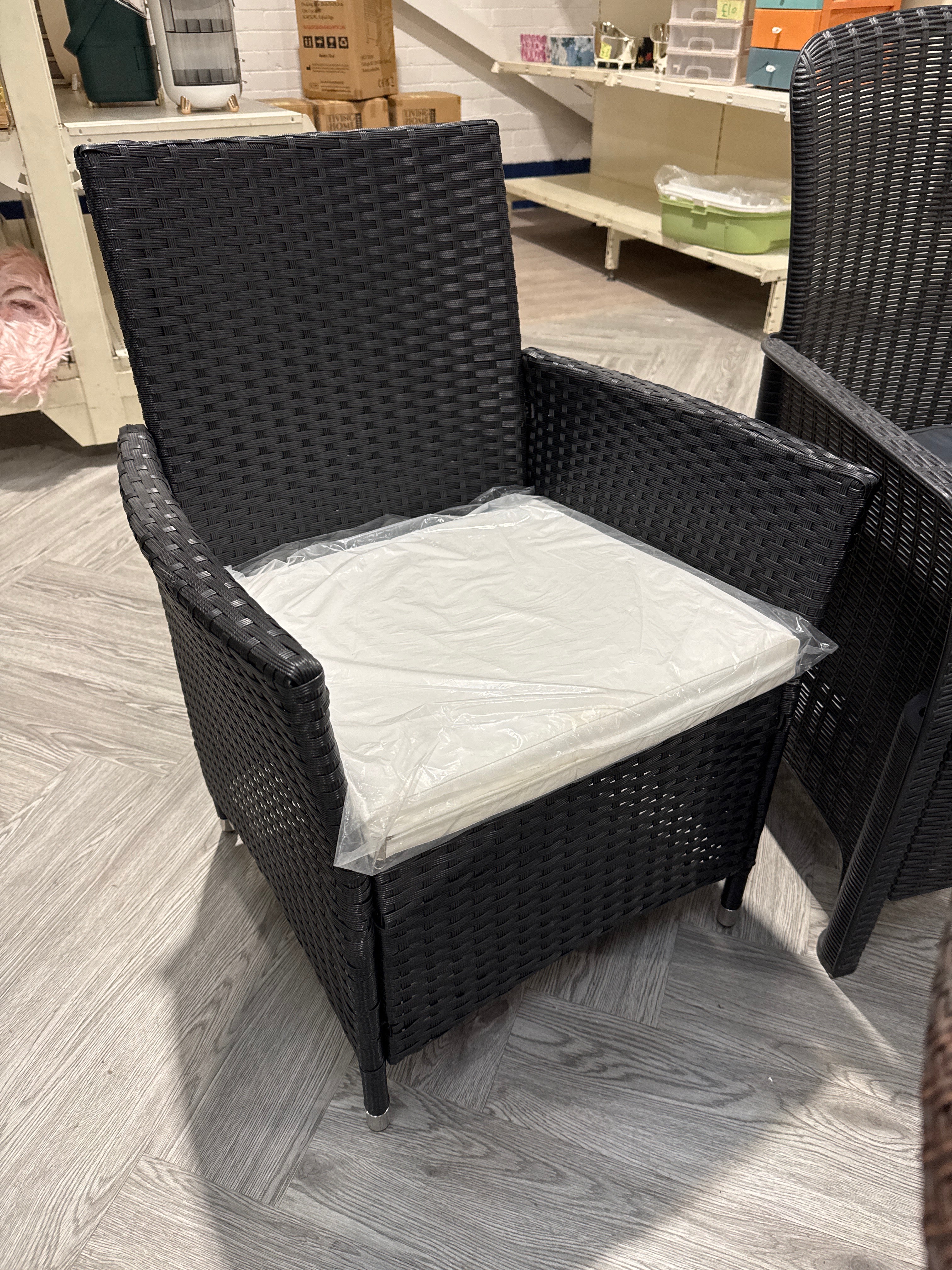 Black Rattan Garden Chair with Beige Seat Cushion